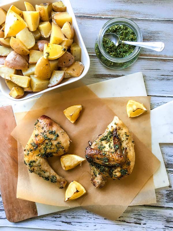 Roasted Chicken and Potatoes topped with tasty Green Herb Sauce - easy one pan meal full of bold flavors!