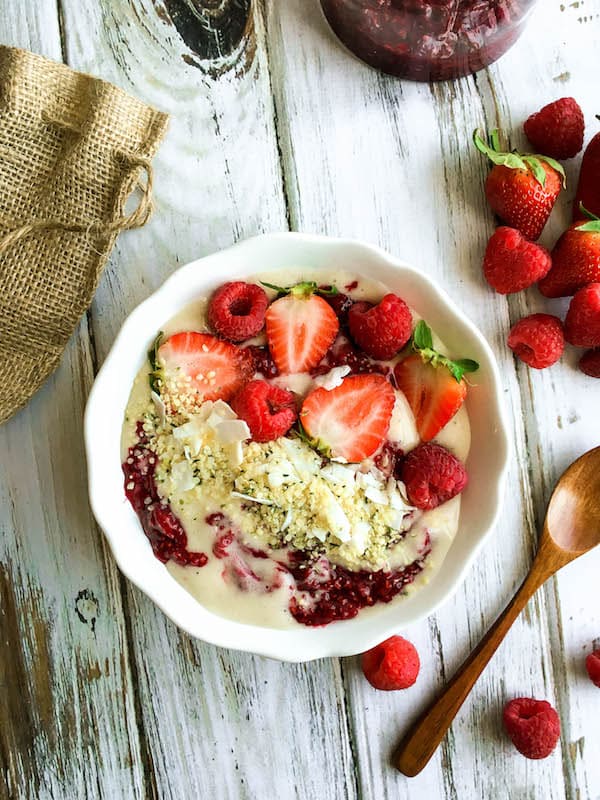 Healthy Smoothie Bowl - Banana "ice cream" topped with Berry Chia Jam, fresh fruit, coconut, and hemp hearts.