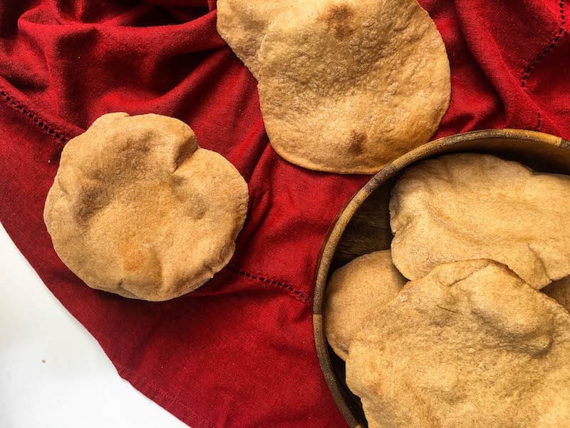 Easy and delicious homemade traditional Greek Pita Bread – you’ll never want to go back to the store-bought version again!