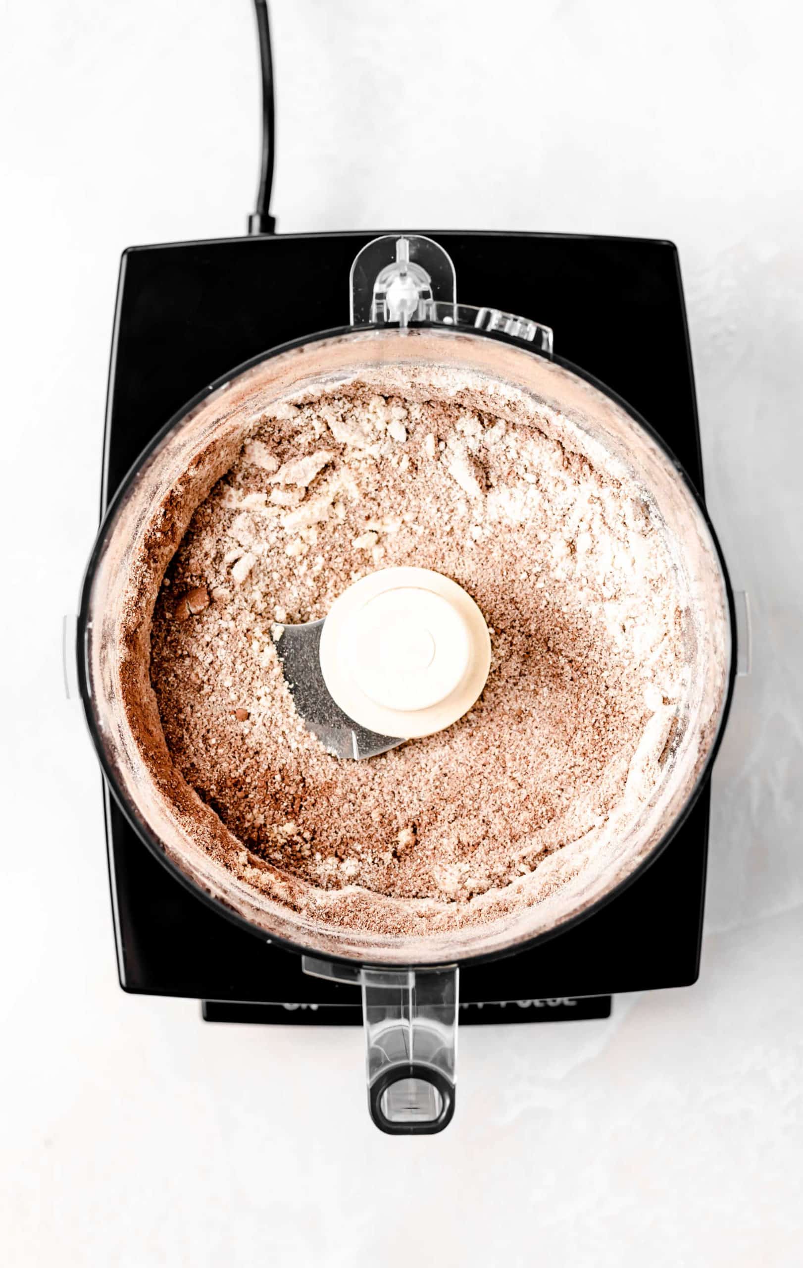 almond flour, oat flour, and cocoa powder in food processor