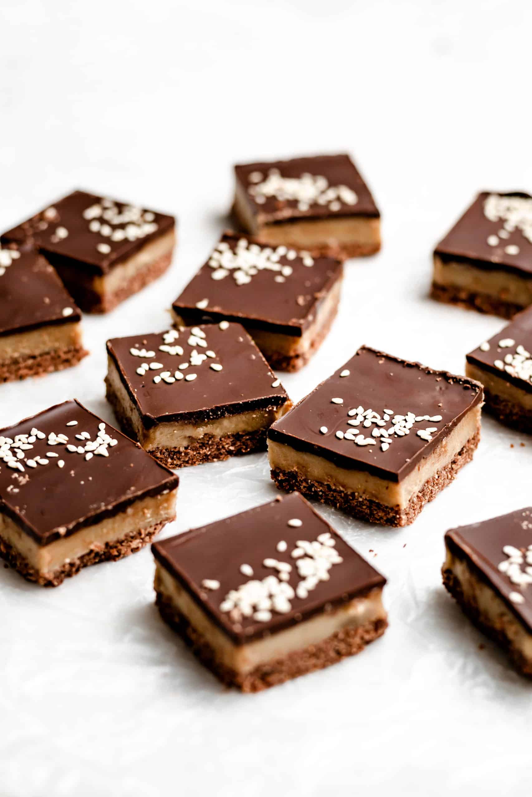 dark chocolate tahini bars on parchment paper