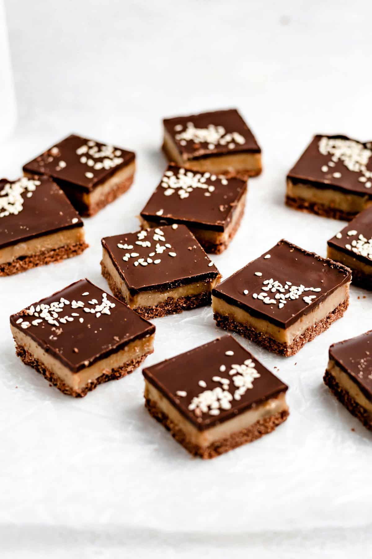 chocolate tahini bars on parchment paper