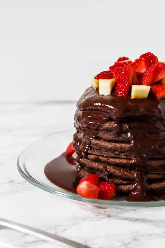 Light and fluffy Chocolate Protein Pancakes are packed with probiotics and fiber in every bite. Made with wholesome ingredients for a quick and healthy breakfast to keep you fueled during busy summer days. (Gluten Free, Dairy Free)