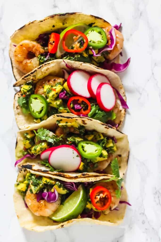 Easy and delicious Grilled Shrimp Tacos with Mango Chimichurri - full of delicious, healthy, & fresh ingredients. Made in 20 minutes!