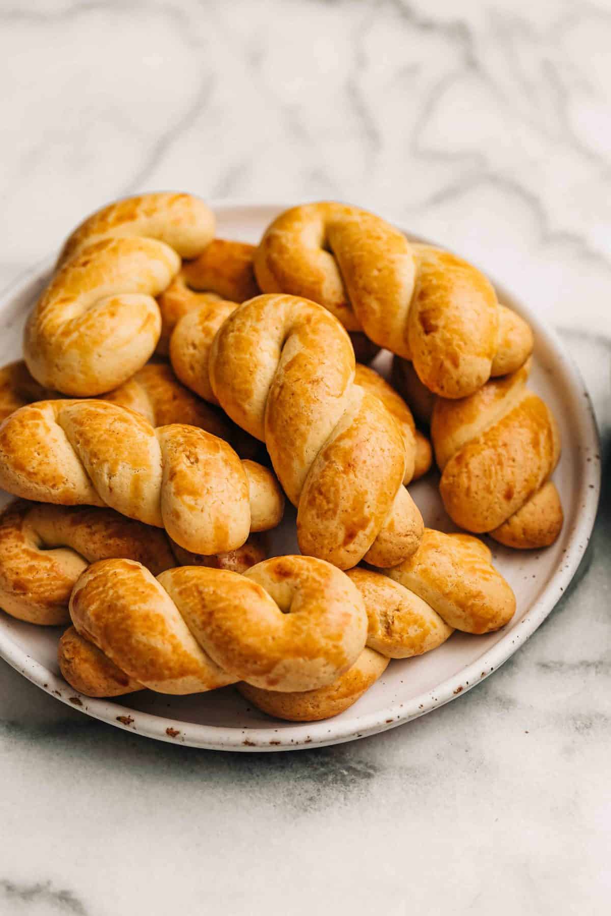 koulourakia on a white ceramic plate.