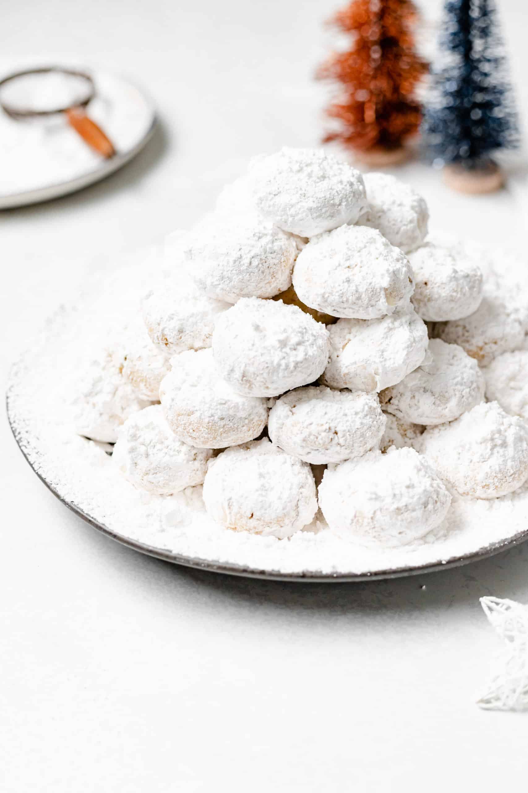 stack of kourabiedes on a plate.
