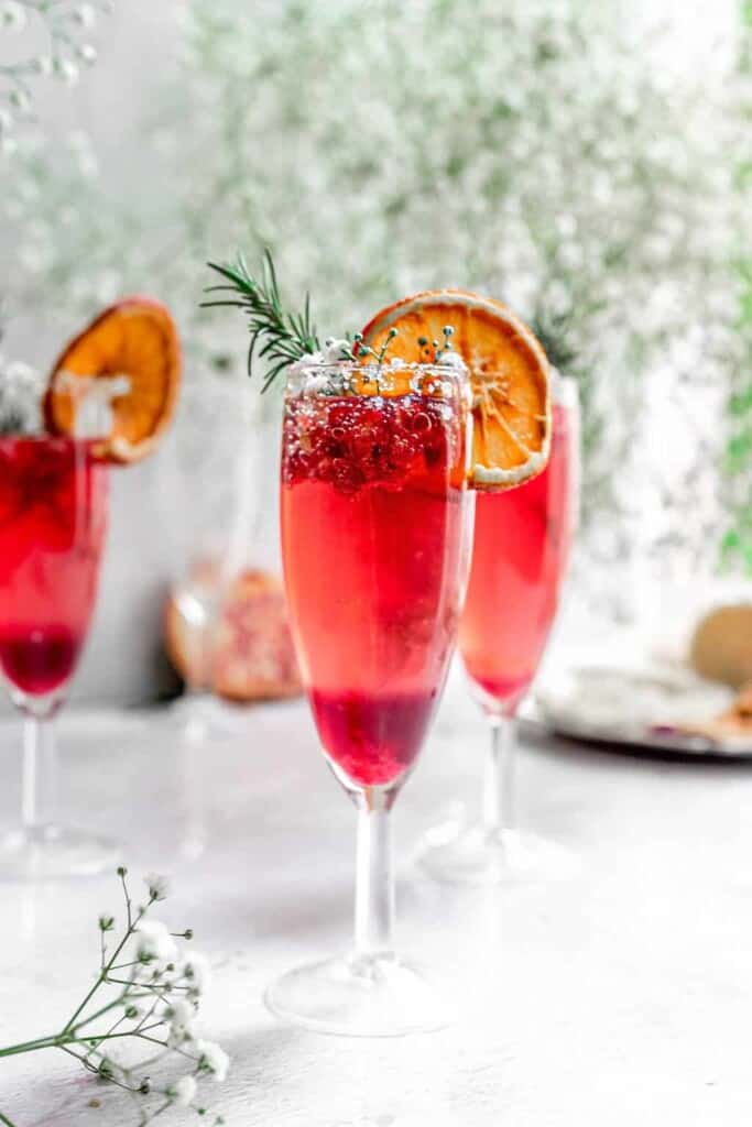 sparkling pomegranate cocktails in champagne flutes