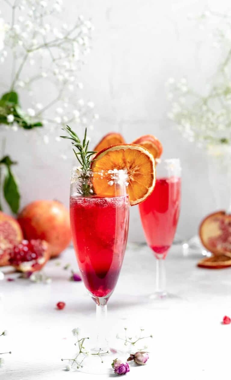 sparkling pomegranate cocktails in champagne flutes