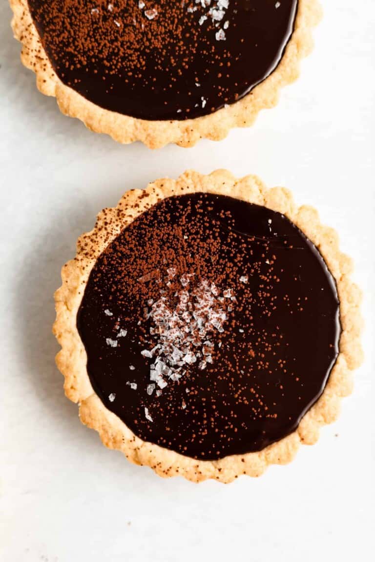 These Mini Dark Chocolate and Sea Salts Tarts have a buttery shortbread crust that’s filled with a rich and decadent truffle-like filling and topped with sea salt!