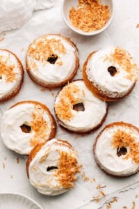 carrot cake donuts on parchment paper.