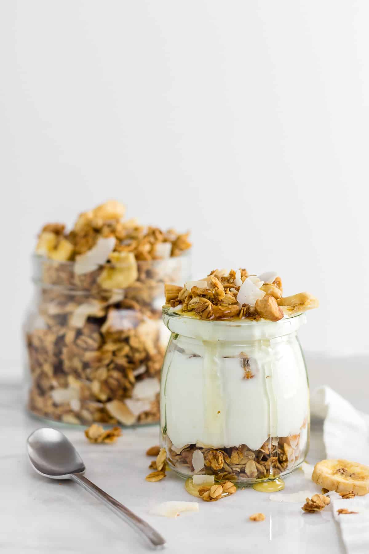 This homemade healthy Banana Coconut Cashew Granola is crunchy, tropical, and completely addicting - made with just a few healthy ingredients! (gluten free + vegan)