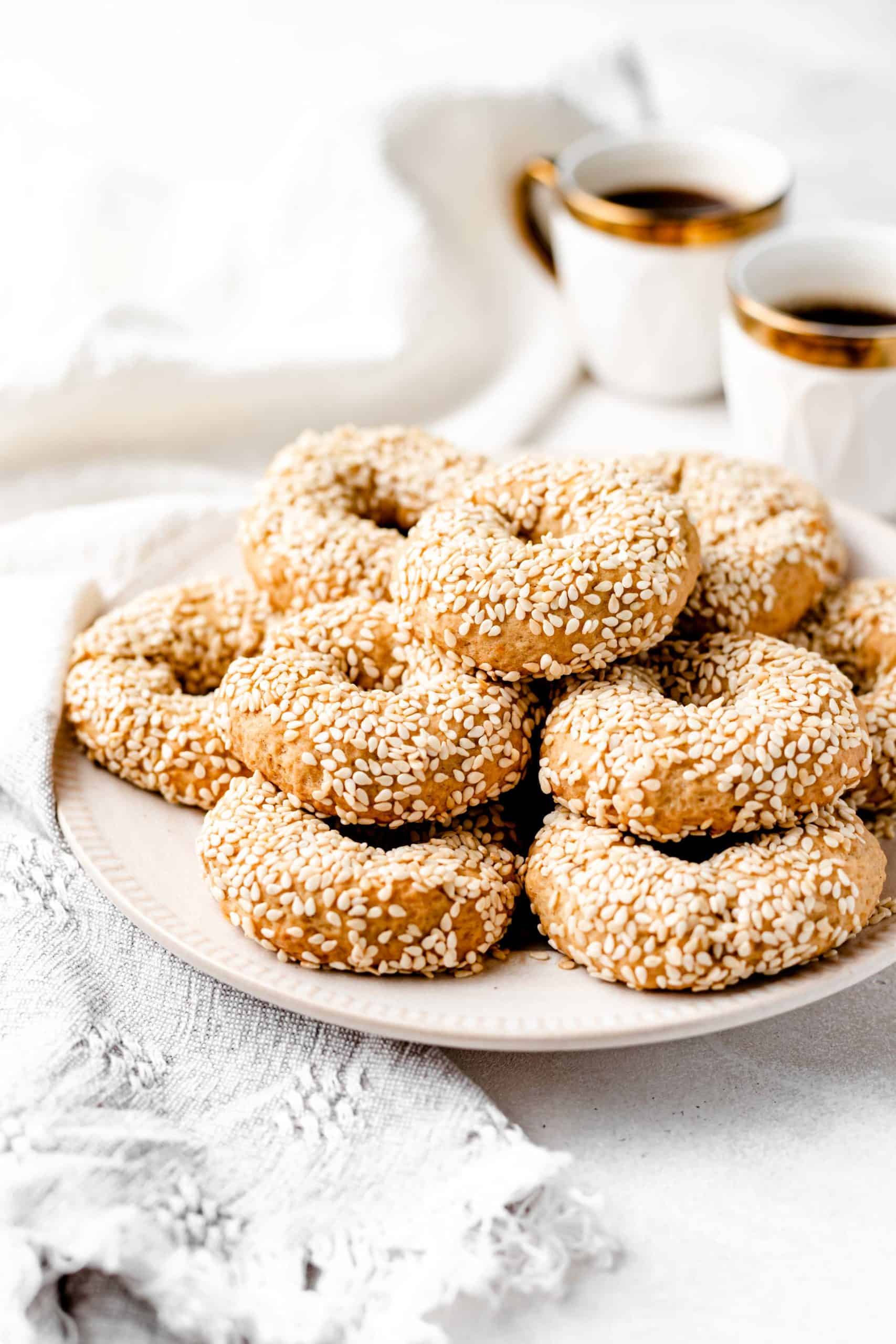 vegan sesame cookies stacked on a plate