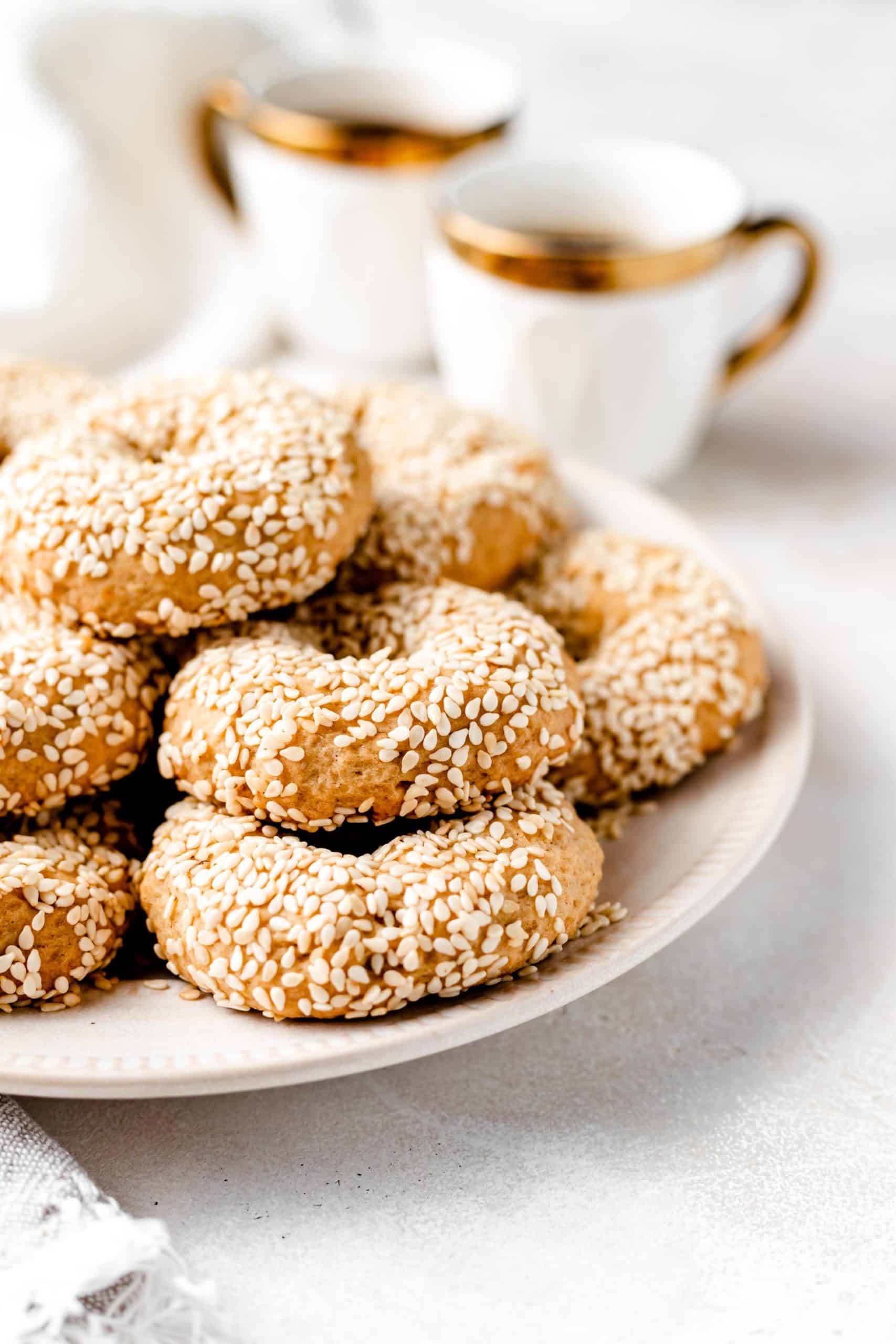 sesame cookies stacked on a plate