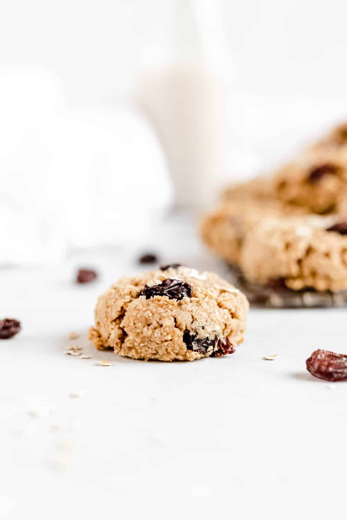 These Healthy Chewy Gluten Free Oatmeal Raisin Cookies are the best ever! They’re incredibly soft, chewy, and perfectly spiced with a hint of cinnamon. #vegan #glutenfree #oatmealraisin #cookies #healthycookies #almondflour #bakedambrosia