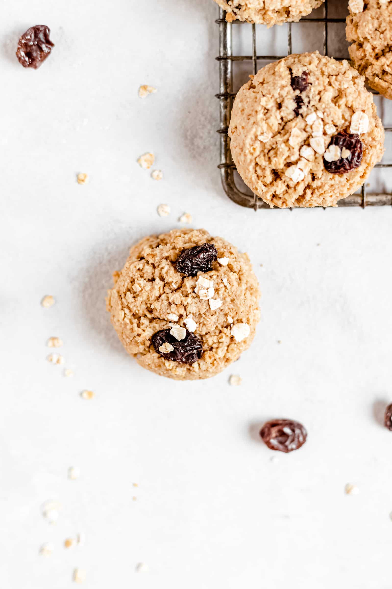 These Healthy Chewy Gluten Free Oatmeal Raisin Cookies are the best ever! They’re incredibly soft, chewy, and perfectly spiced with a hint of cinnamon. #vegan #glutenfree #oatmealraisin #cookies #healthycookies #almondflour #bakedambrosia