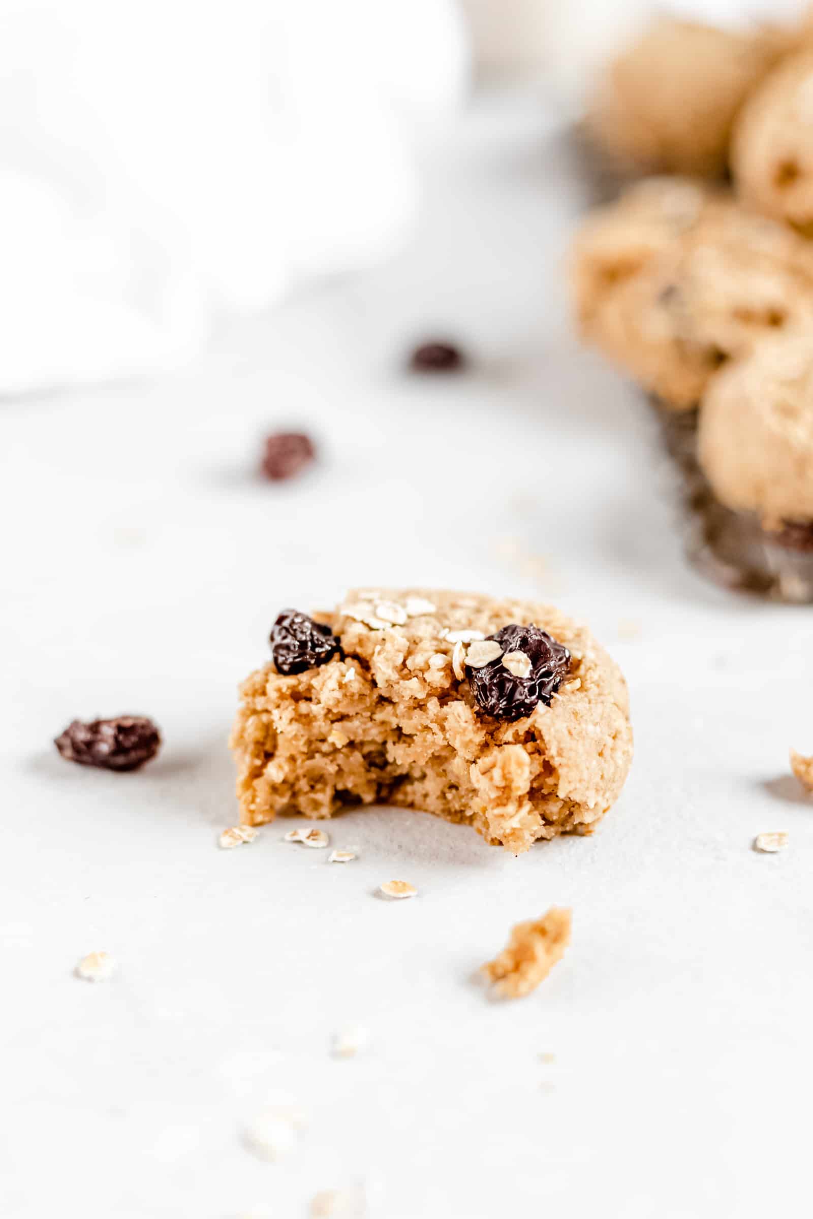 These Healthy Chewy Gluten Free Oatmeal Raisin Cookies are the best ever! They’re incredibly soft, chewy, and perfectly spiced with a hint of cinnamon. #vegan #glutenfree #oatmealraisin #cookies #healthycookies #almondflour #bakedambrosia