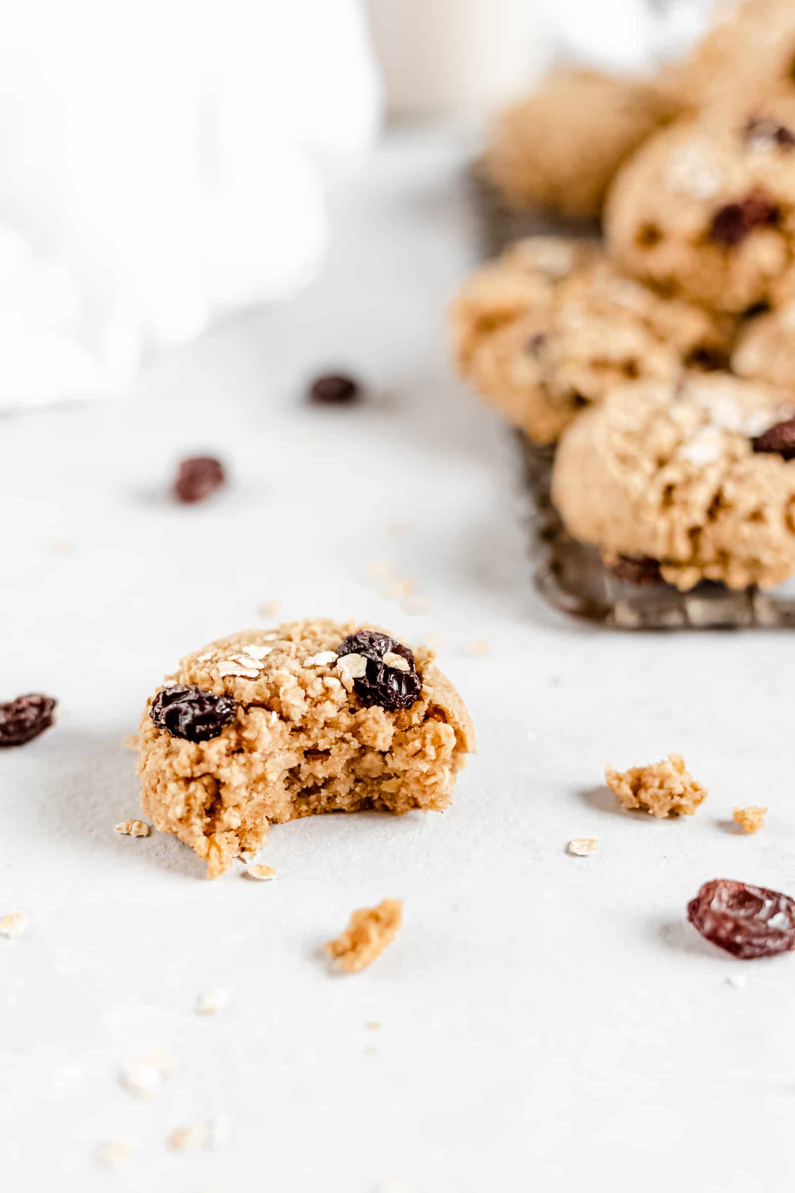 These Healthy Chewy Gluten Free Oatmeal Raisin Cookies are the best ever! They’re incredibly soft, chewy, and perfectly spiced with a hint of cinnamon. #vegan #glutenfree #oatmealraisin #cookies #healthycookies #almondflour #bakedambrosia