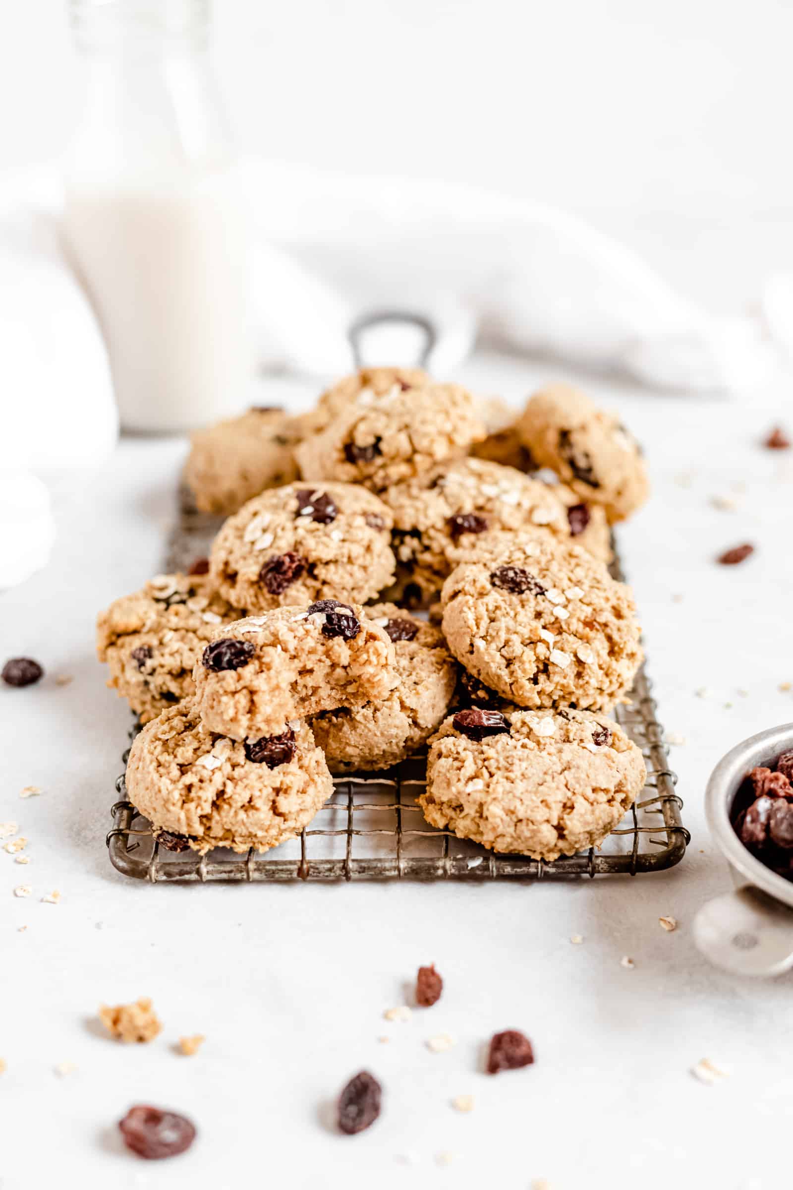 These Healthy Chewy Gluten Free Oatmeal Raisin Cookies are the best ever! They’re incredibly soft, chewy, and perfectly spiced with a hint of cinnamon. #vegan #glutenfree #oatmealraisin #cookies #healthycookies #almondflour #bakedambrosia