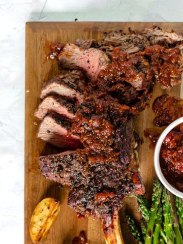 Grilled Black Peppercorn Tomahawk Ribeye with Spicy Barbecue Relish