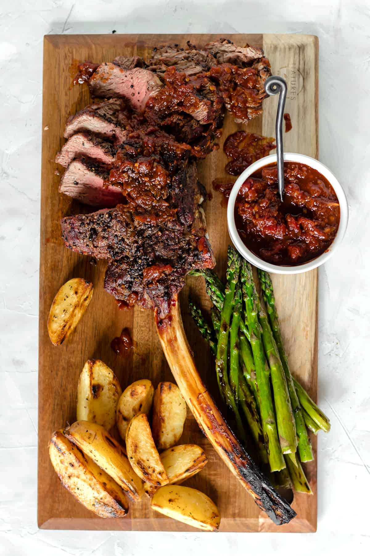 Grilled Black Peppercorn Tomahawk Ribeye with Spicy Barbecue Relish