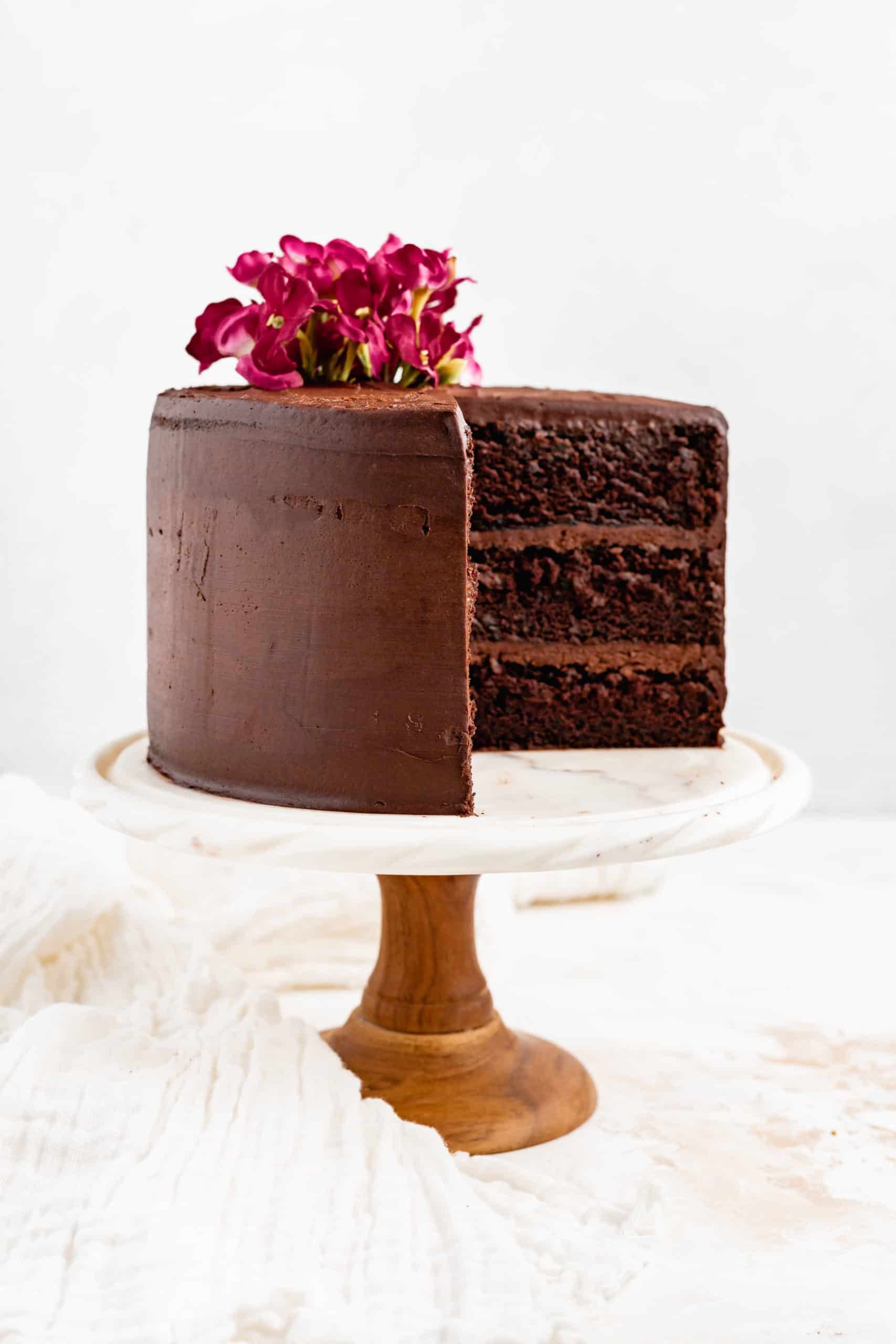 red wine chocolate layer cake on cake stand