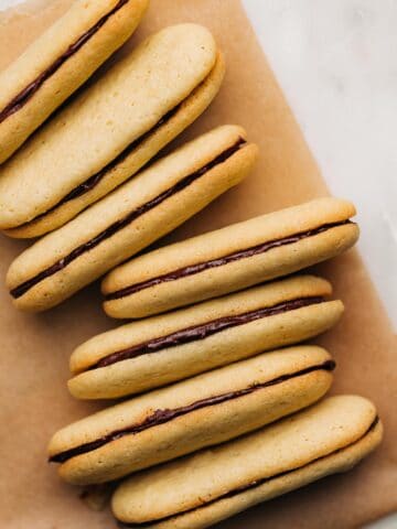 Milano cookies on a piece of brown parchment paper.