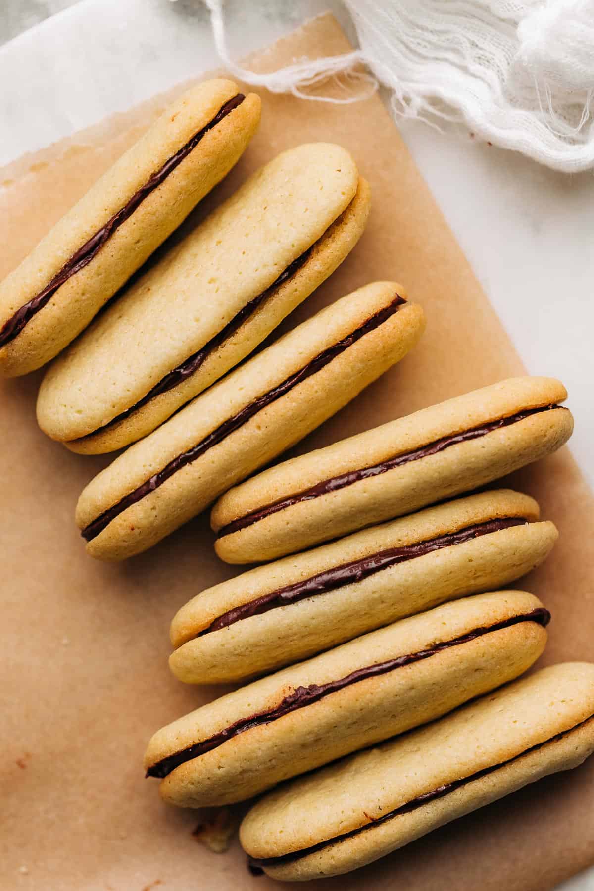 Milano cookies on brown parchment paper.