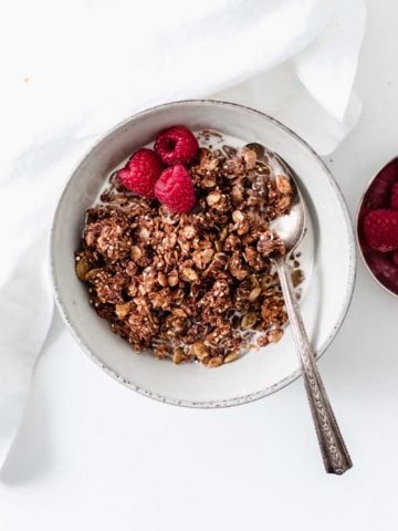 Homemade superfood chocolate espresso granola will be your new go-to breakfast or snack. This crunchy naturally sweetened granola is addicting, delicious, and nutritious.