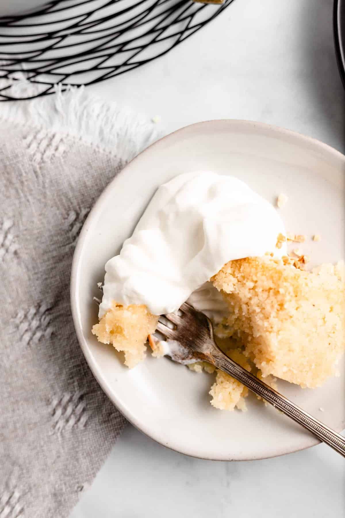 This dense Orange Blossom Semolina Cake is sweet, moist, and absolutely delicious. Soaked in a blossom water syrup, this easy one-bowl Middle Eastern dessert will be one of your favorites!