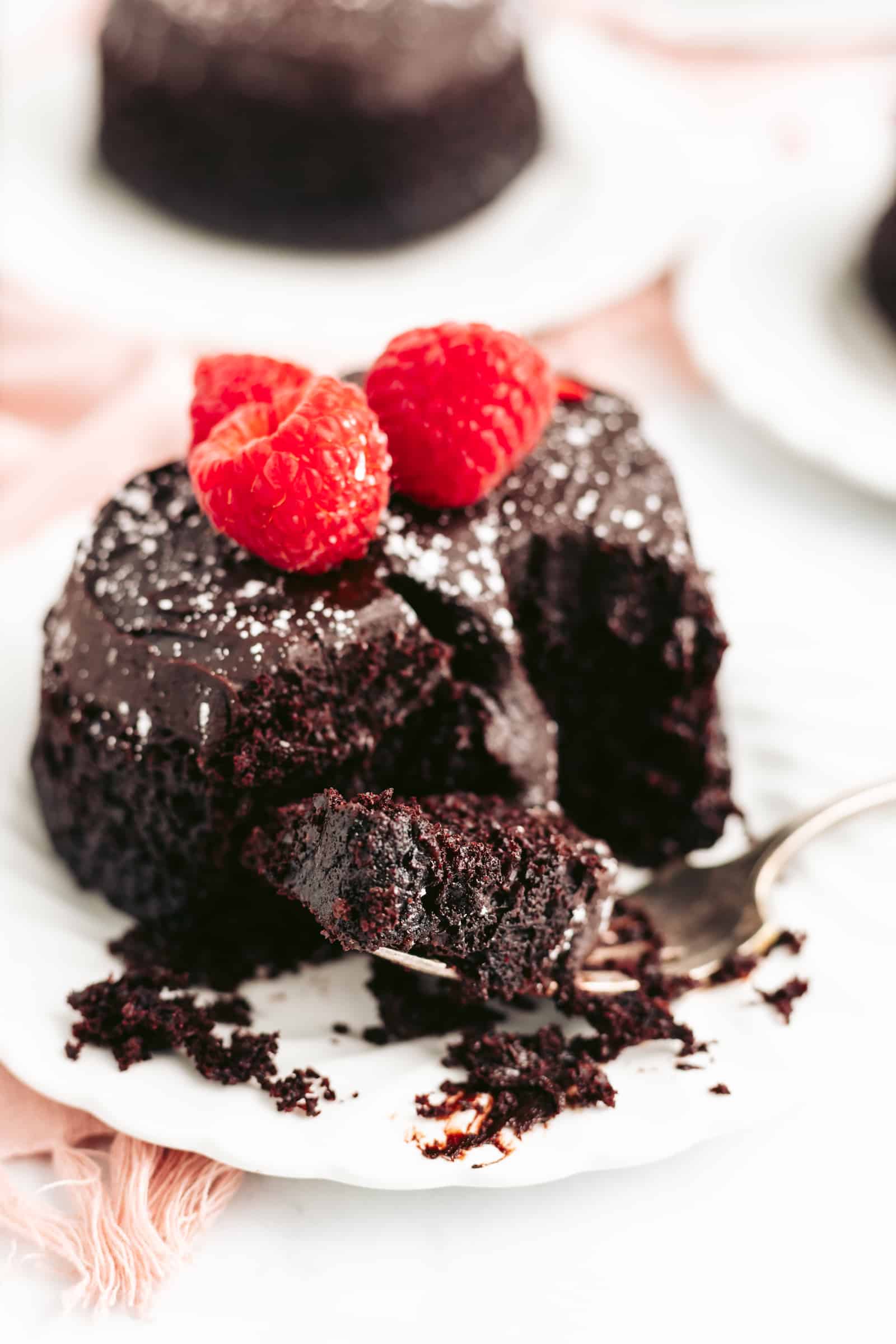 The best one-bowl chocolate cake is accidentally vegan! Topped with avocado fudge frosting, this cake is rich, moist, and decadent. Perfect for Valentine's Day!