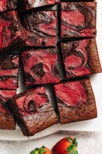 strawberry brownies on parchment paper.