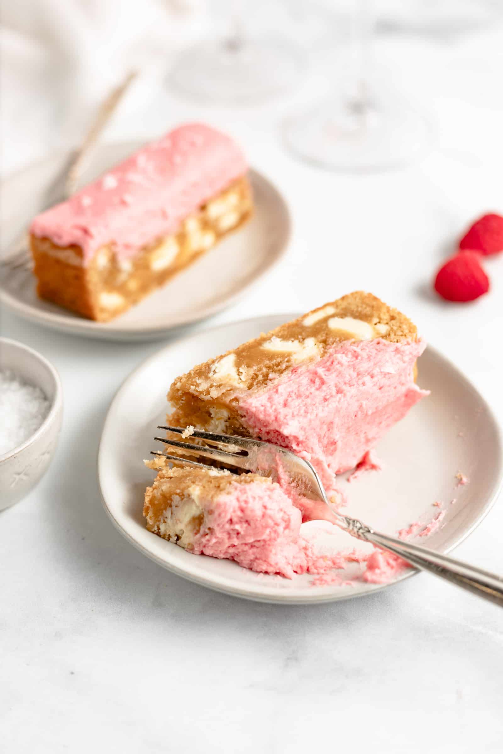 The only blondie recipe you need!! Studded with white chocolate and topped with raspberry frosting.