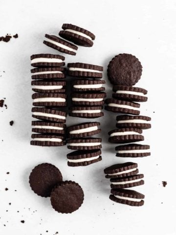 An easy and delicious gourmet version of everyone's favorite childhood treat - Homemade Oreo Cookies are crisp chocolate cookies with a cream-filled center.