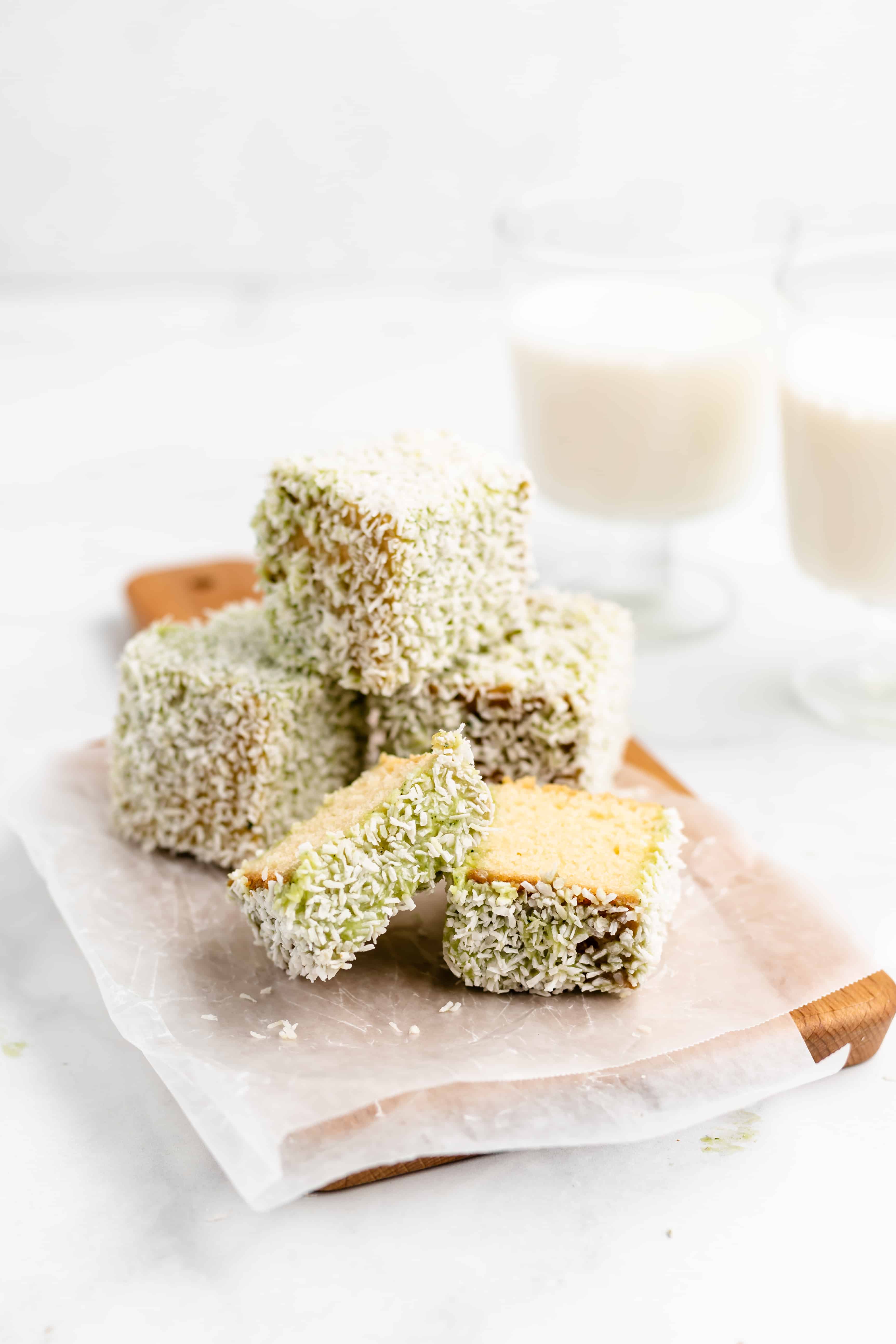 White Chocolate Lamingtons - almond flavored butter cake dipped in white chocolate and coated with coconut. #lamington