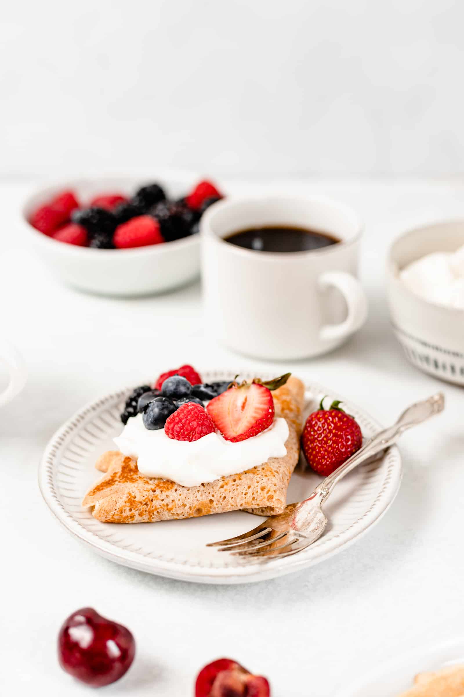 crepes with cream and berries