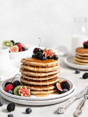 Protein pancakes with berries, fruits, and maple syrup.