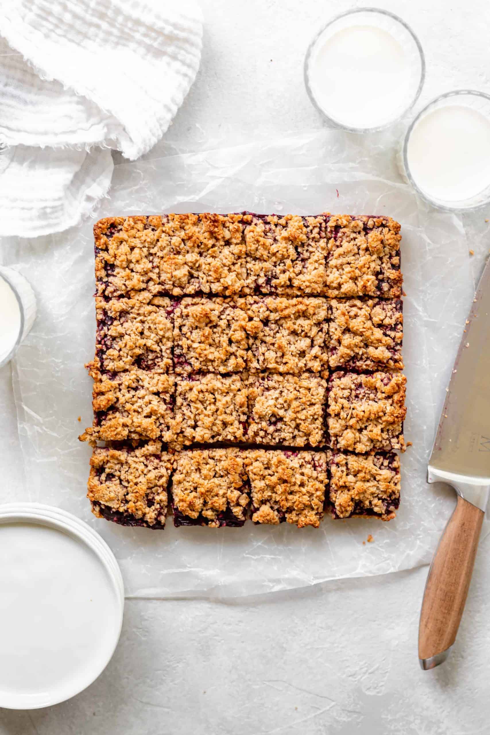 healthy blackberry oat crumb bars on parchment paper