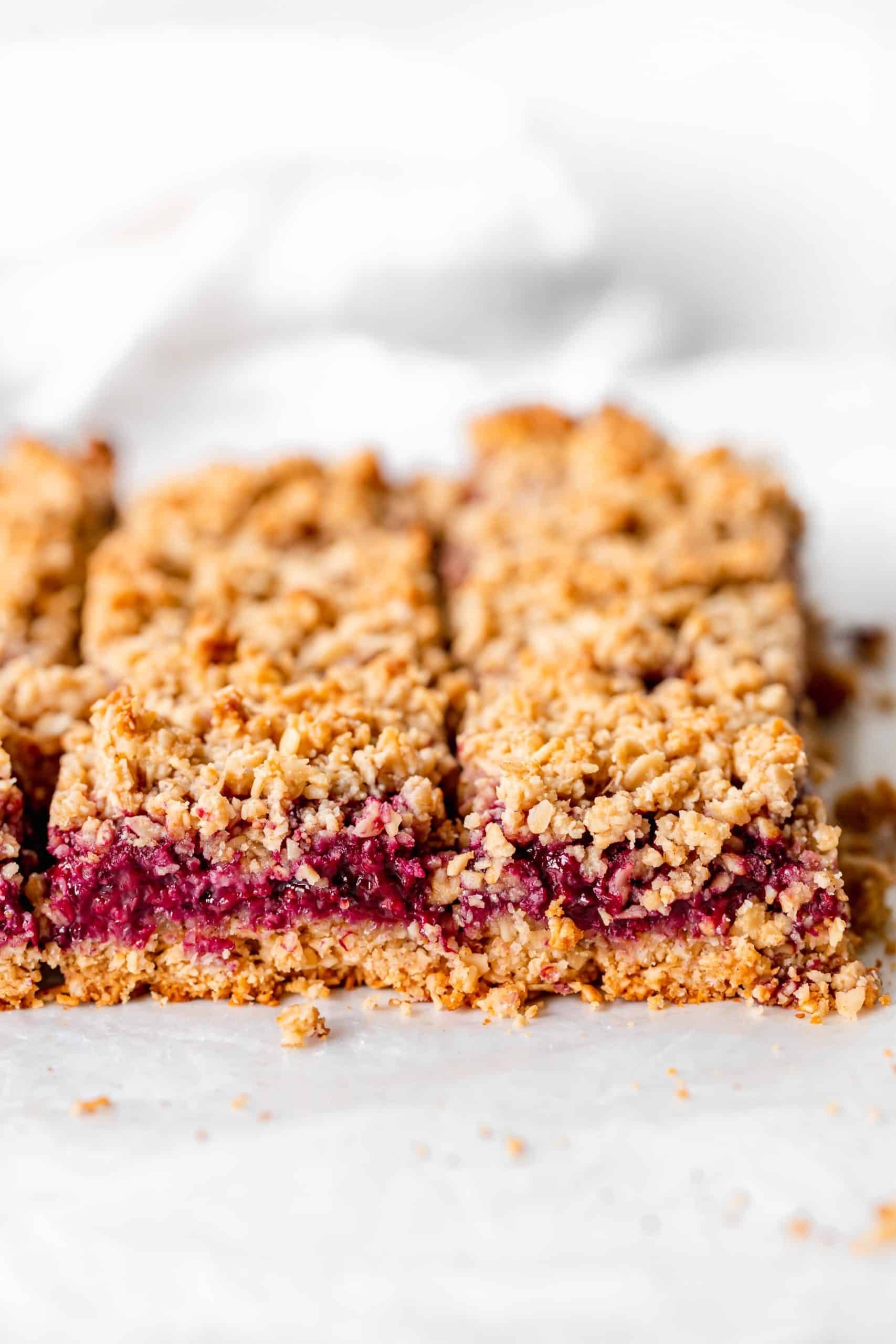 Vegan blackberry crumb bars on parchment paper