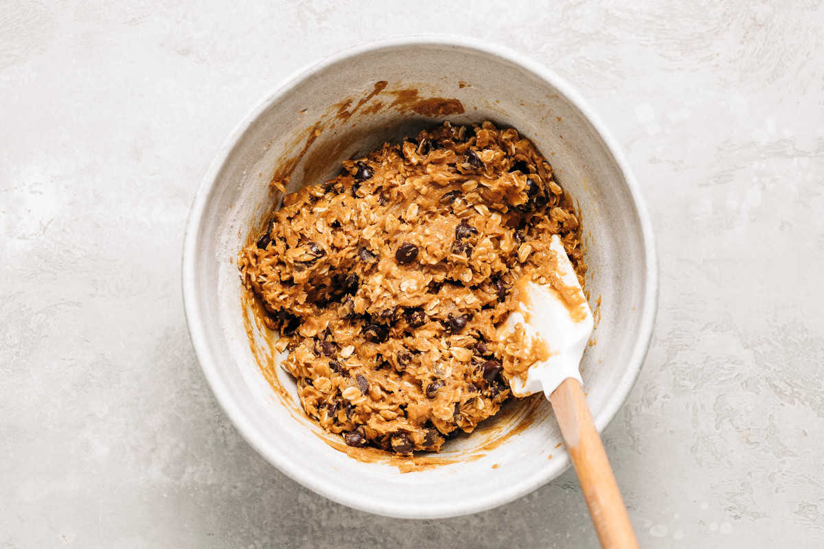 Oatmeal chocolate chip cookie dough in a bowl.