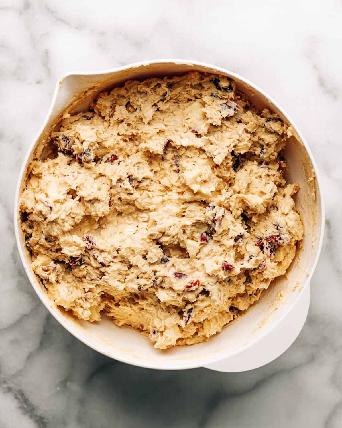  cranberry white chocolate chip cookie dough in a mixing bowl.