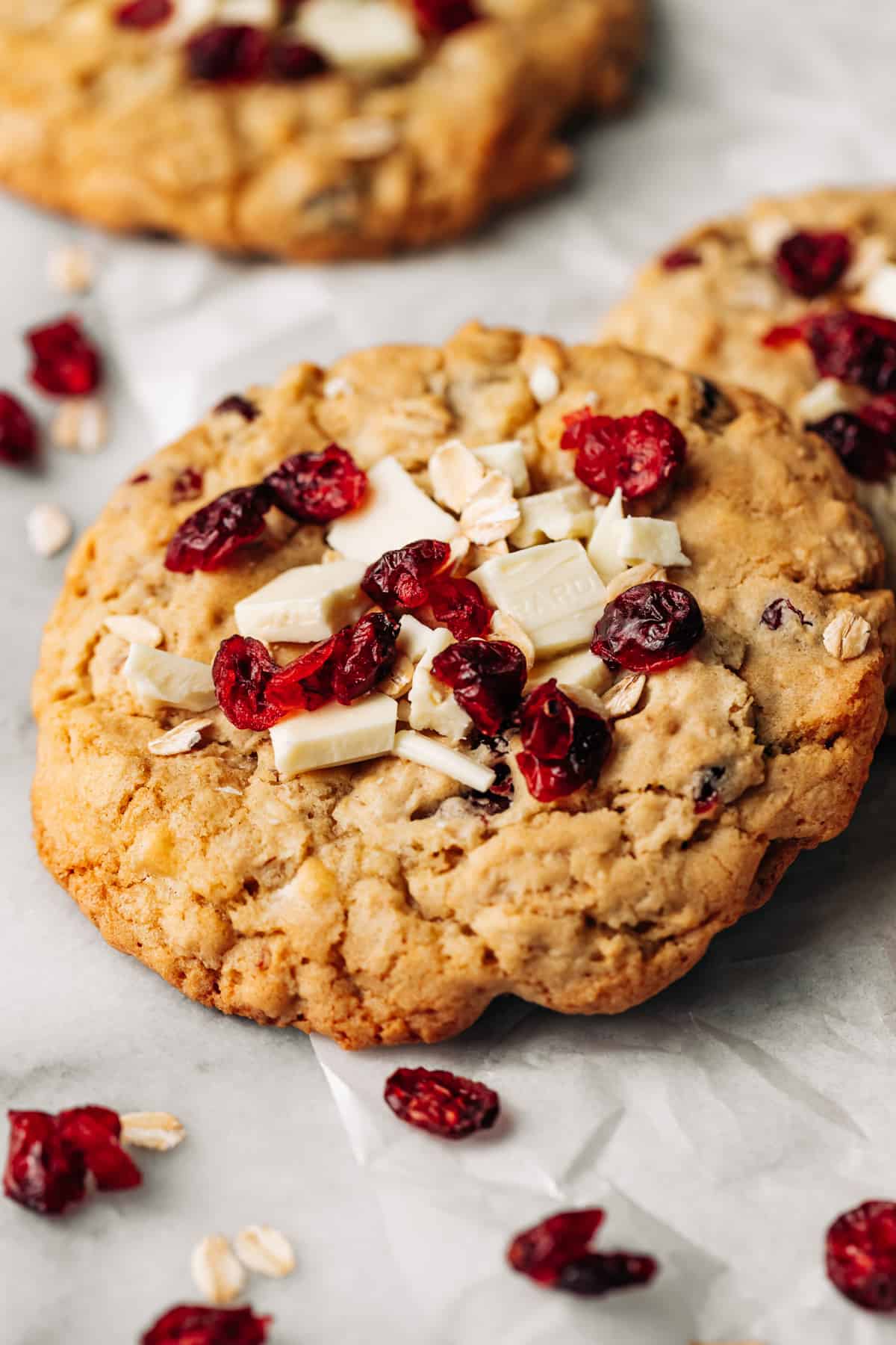 white chocolate cranberry cookies on parchment paper.