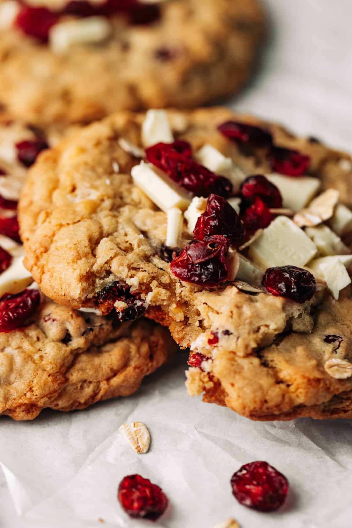 bite shot of a cranberry white chocolate oatmeal cookie.