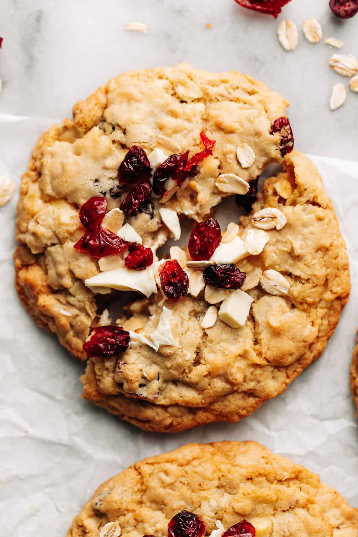 white chocolate cranberry oatmeal cookie cut in half.