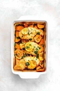 lemon chicken with sweet potatoes in roasting pan