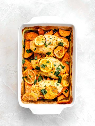 lemon chicken with sweet potatoes in roasting pan