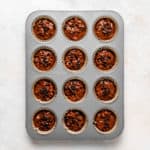 Gluten Free Chocolate Peanut Butter Banana Muffin batter in muffin pan