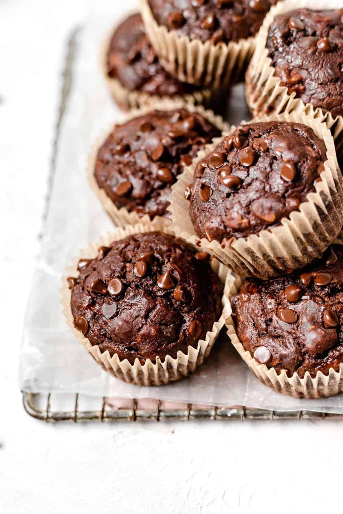 chocolate peanut butter banana muffins on a wire rack