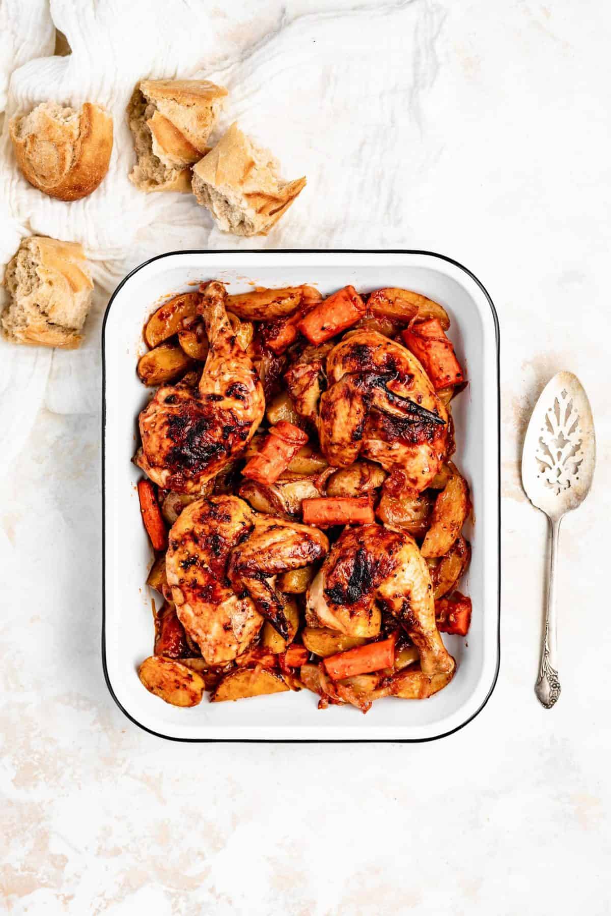 roasted chicken and potatoes in pan