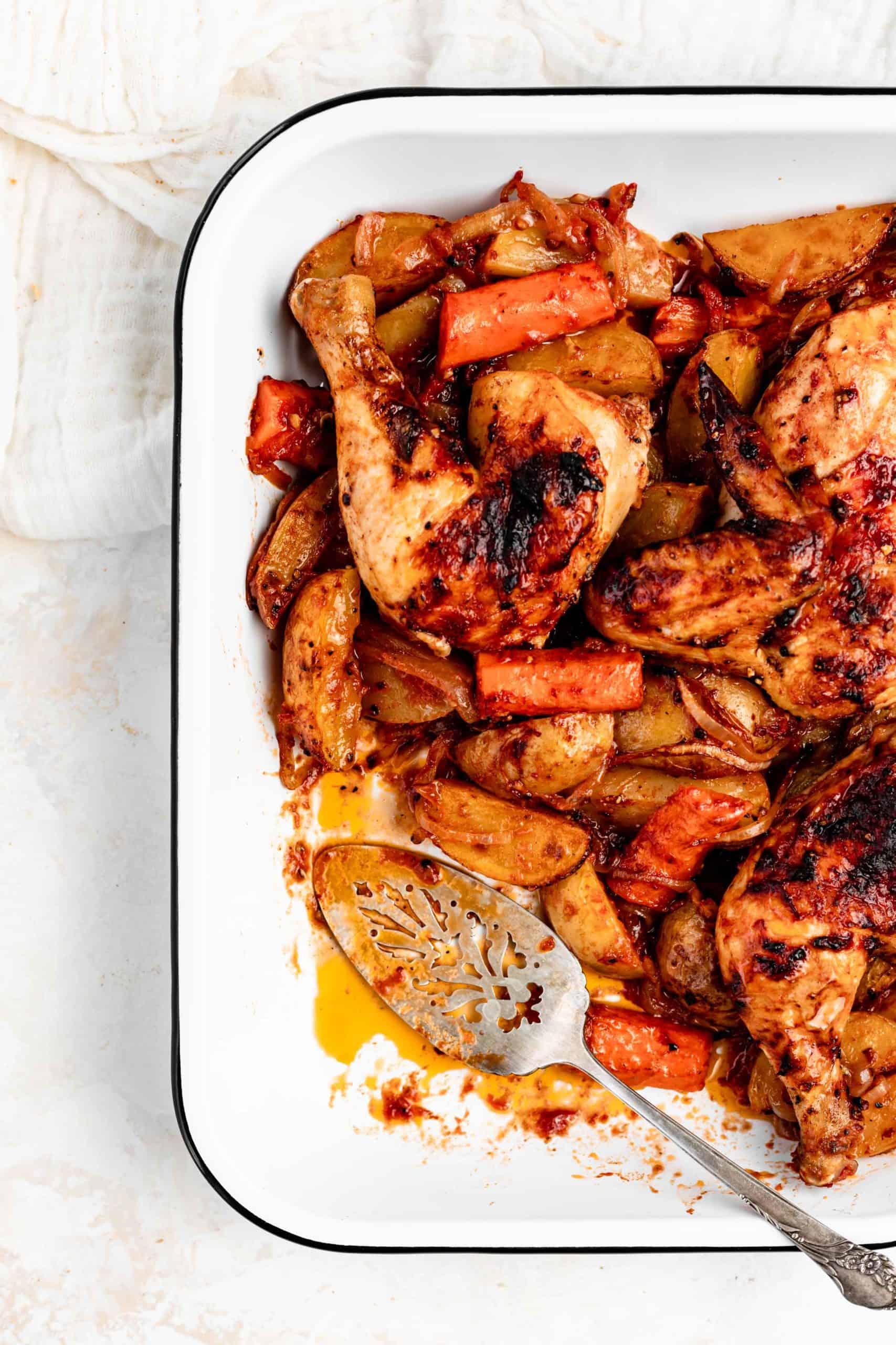 roasted chicken and potatoes in pan