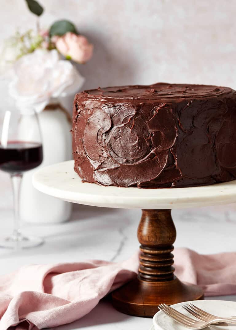 red wine chocolate cake on a cake stand.